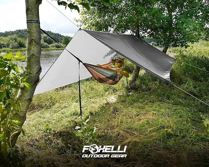 Foxelli Hammock Rain Fly - Waterproof Lightweight Tent & Hammock Rain Tarp for Camping, Backpacking w/Easy Setup Including Extra Long Guy Lines & Stakes